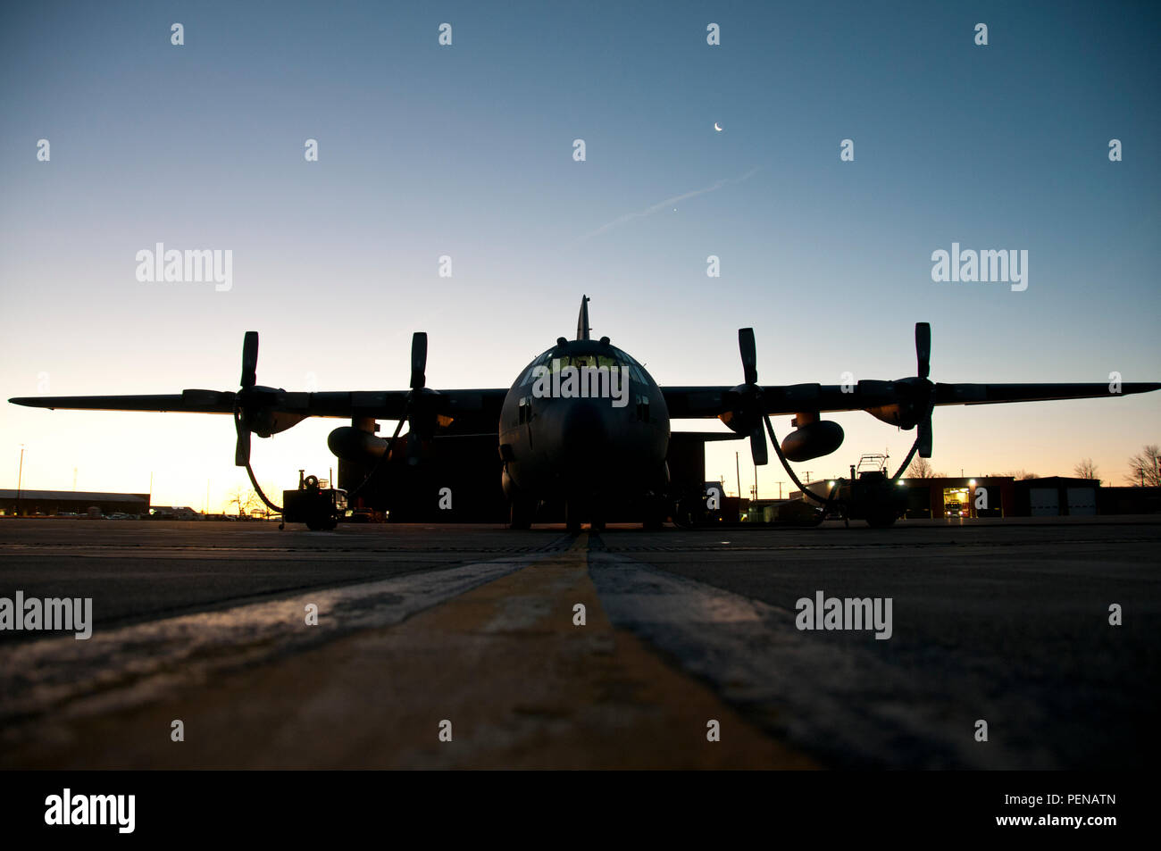 C-130H Hercules sit on a cold flightline as heaters prepare the turbo prop engines for the day at the 179th Airlift Wing, Mansfield, Ohio, Jan. 6, 2015. The Ohio Air National Guard unit is always on mission to respond with highly qualified citizen-airmen to execute Federal, State and community missions. (U.S. Air National Guard photo by Tech. Sgt. Joe HarwoodReleased) Stock Photo