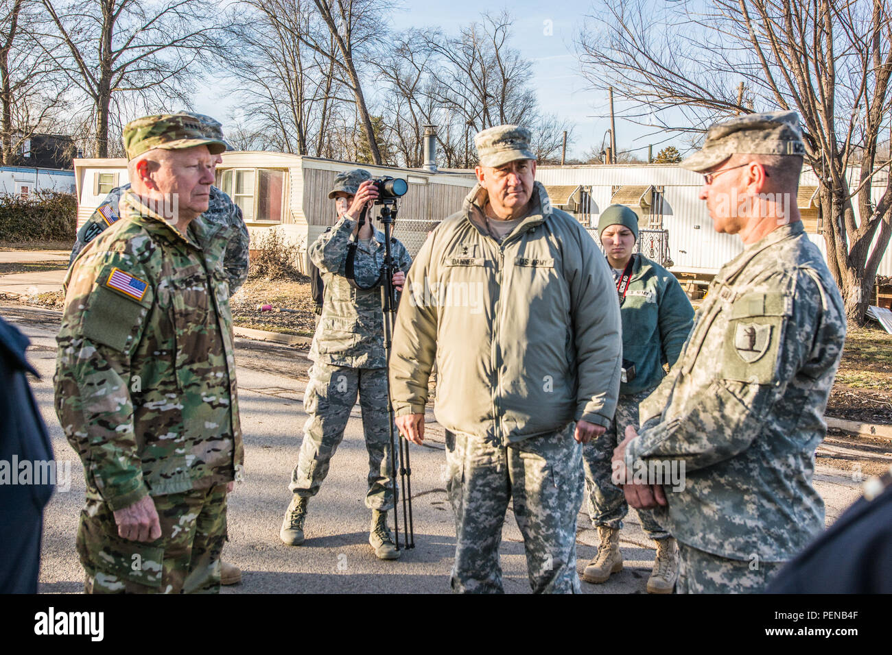 Army Gen. Frank J. Grass (left), chief of the National Guard Bureau, tours flood-damaged areas in Pacific, Mo., Jan. 5, 2016. Soldiers and Airmen with the Missouri National Guard volunteered to support the Missouri Department of Transportation in flood relief efforts in south central Missouri. The focus of the aid is to ensure traffic control, water purification and levee reinforcement in affected areas. (Missouri Air National Guard photo by Senior Airman Patrick P. Evenson/Released) Stock Photo