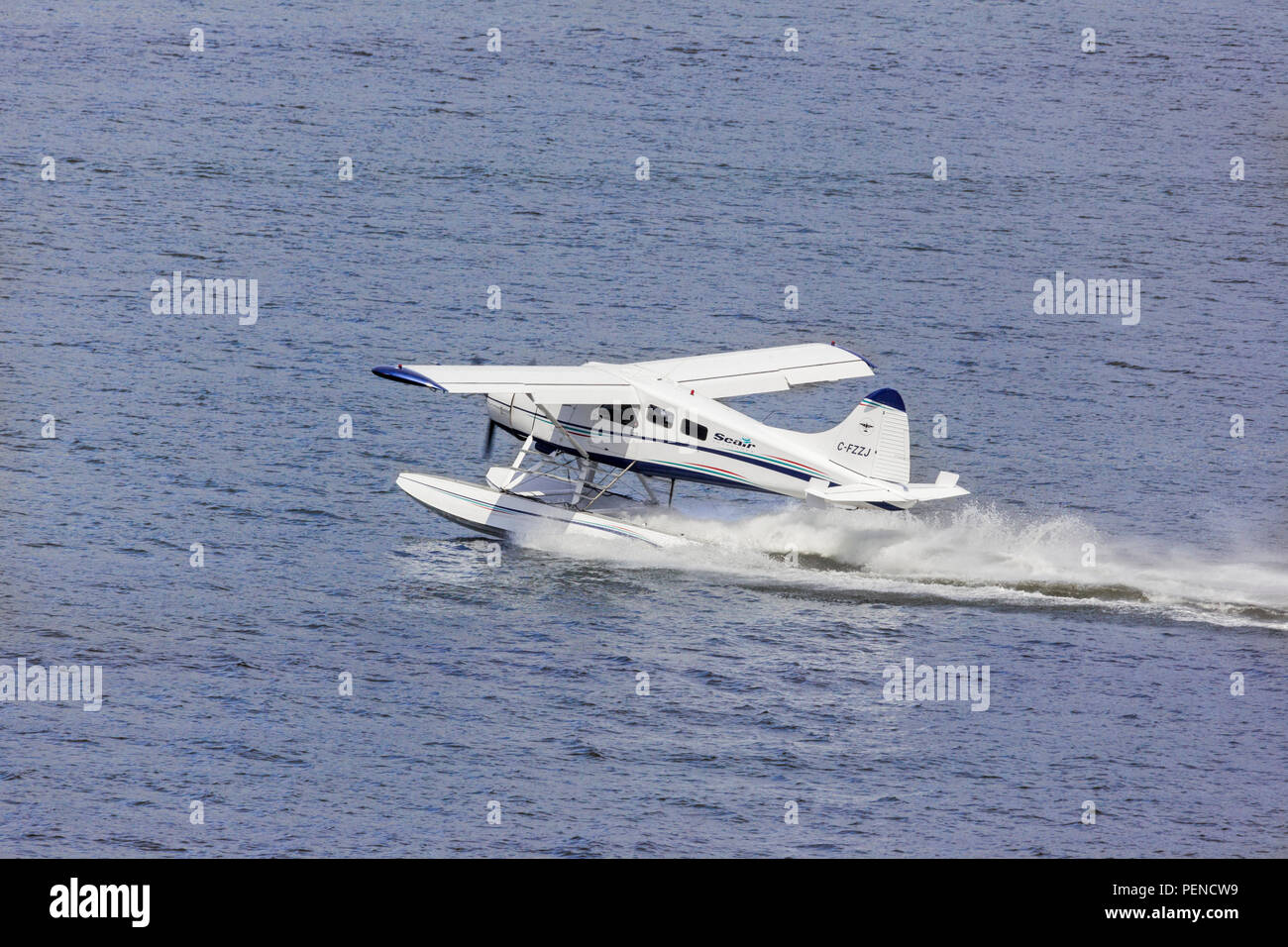 Seaplane C-FZZJ, a De Havilland DHC-2 Beaver Mk.1, taking tourists for a pleasure flight from the harbour at Vancouver, British Columbia, Canada Stock Photo