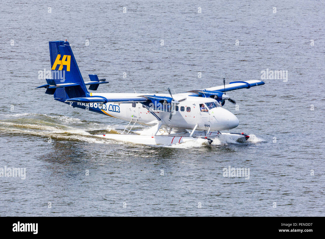 Seaplane C-FGQH, a De Havilland DHC-6-100 Twin Otter, taking tourists for a pleasure flight from the harbour at Vancouver, British Columbia, Canada Stock Photo