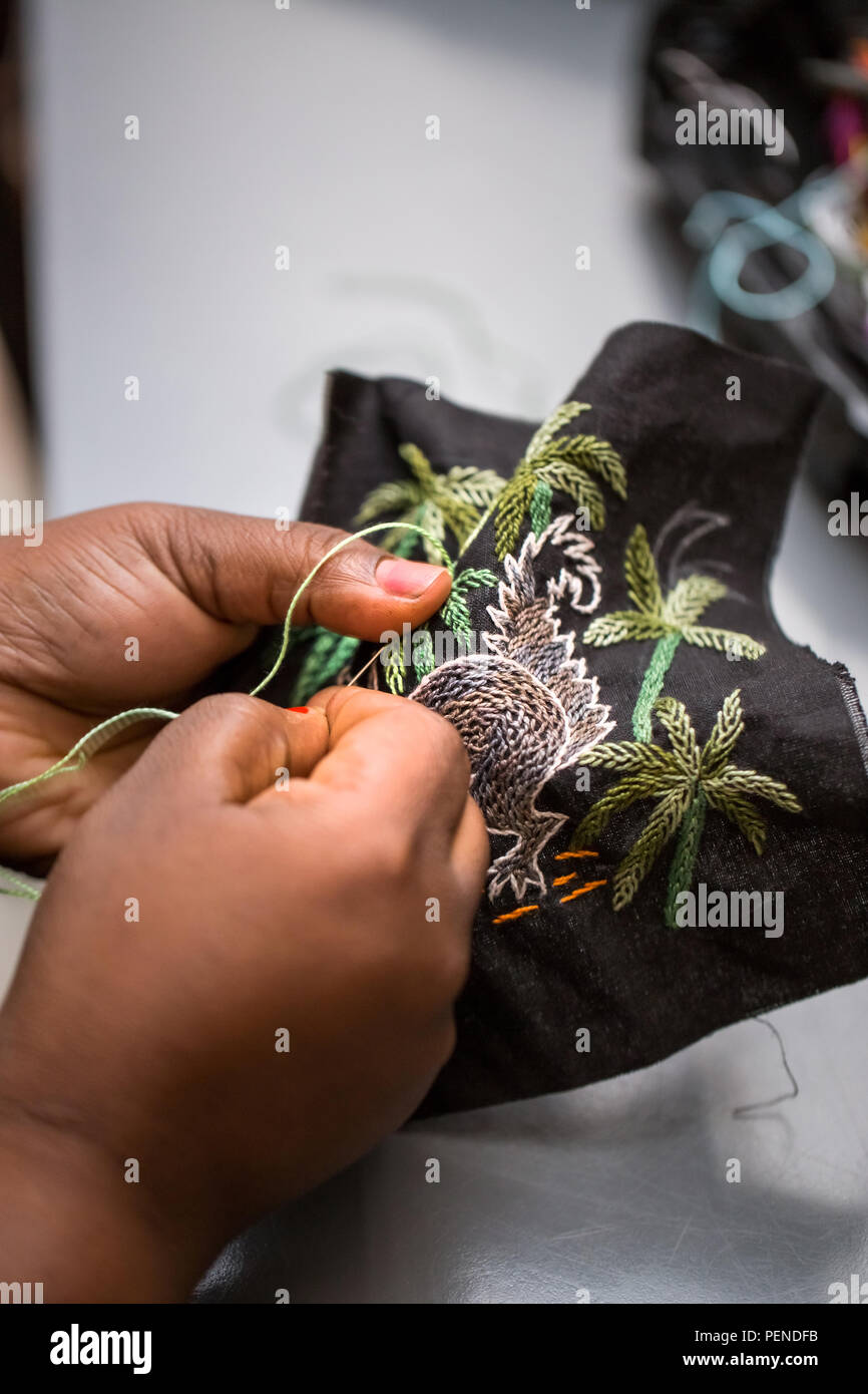 Close up of hands doing embroidery work. Stock Photo