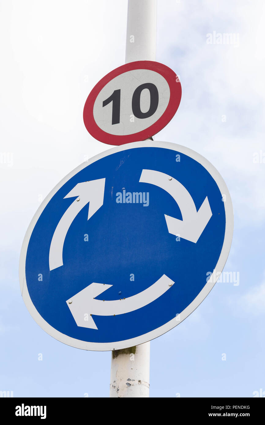 Street sign indicating a speed limit of 10 miles per hour and a