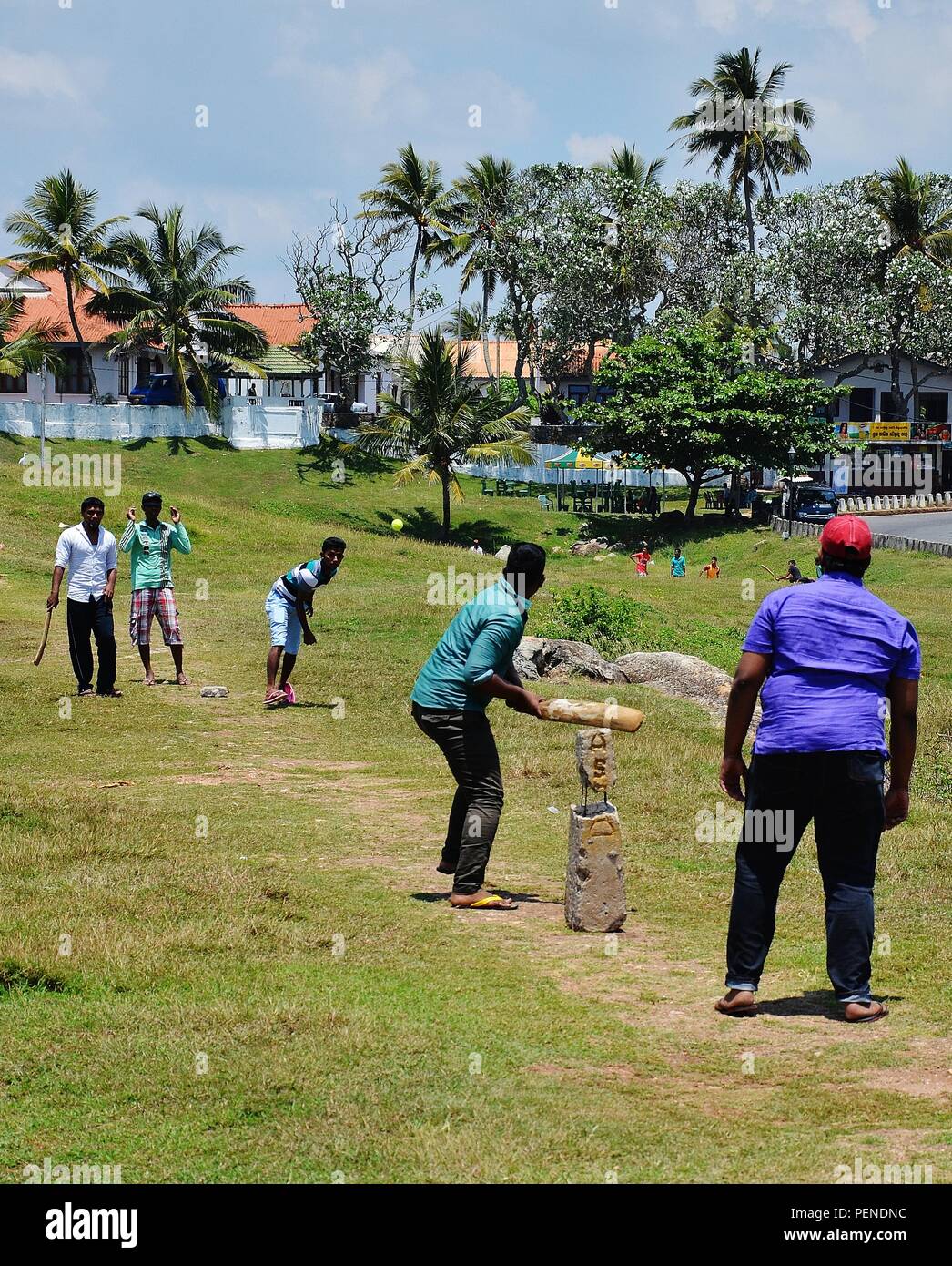 locals playing cricket inside Galle Fort, Sri Lanka Stock Photo