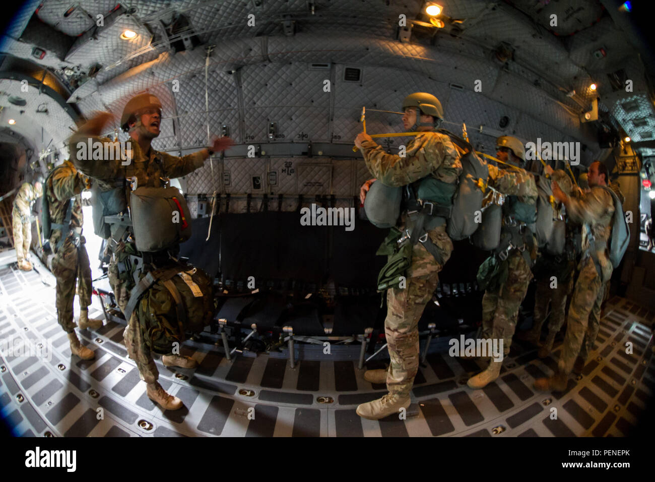 A U.S. Army jump master assigned to Special Operations Command South commands his chalk to