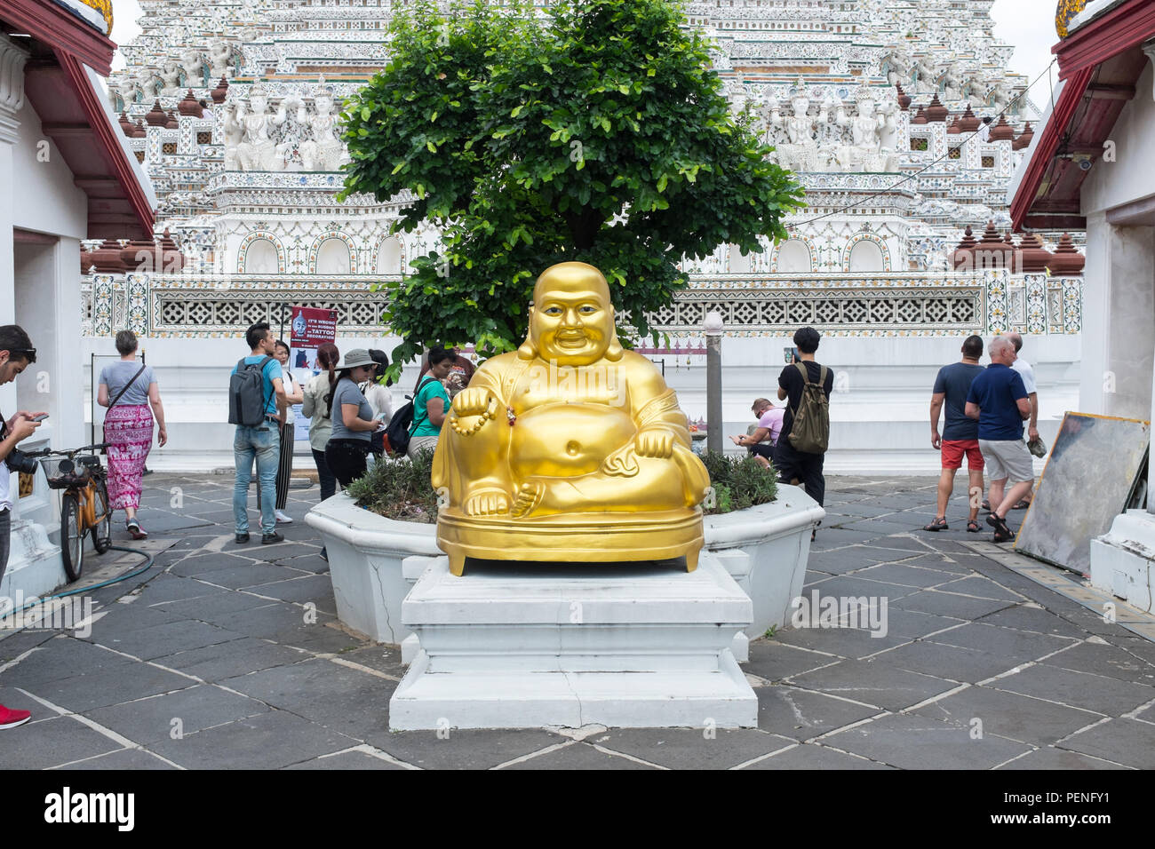 Gold Buddha statue at Wat Arun or the Temple of Dawn on the bank of the Chao Phraya River in Bangkok, Thailand Stock Photo