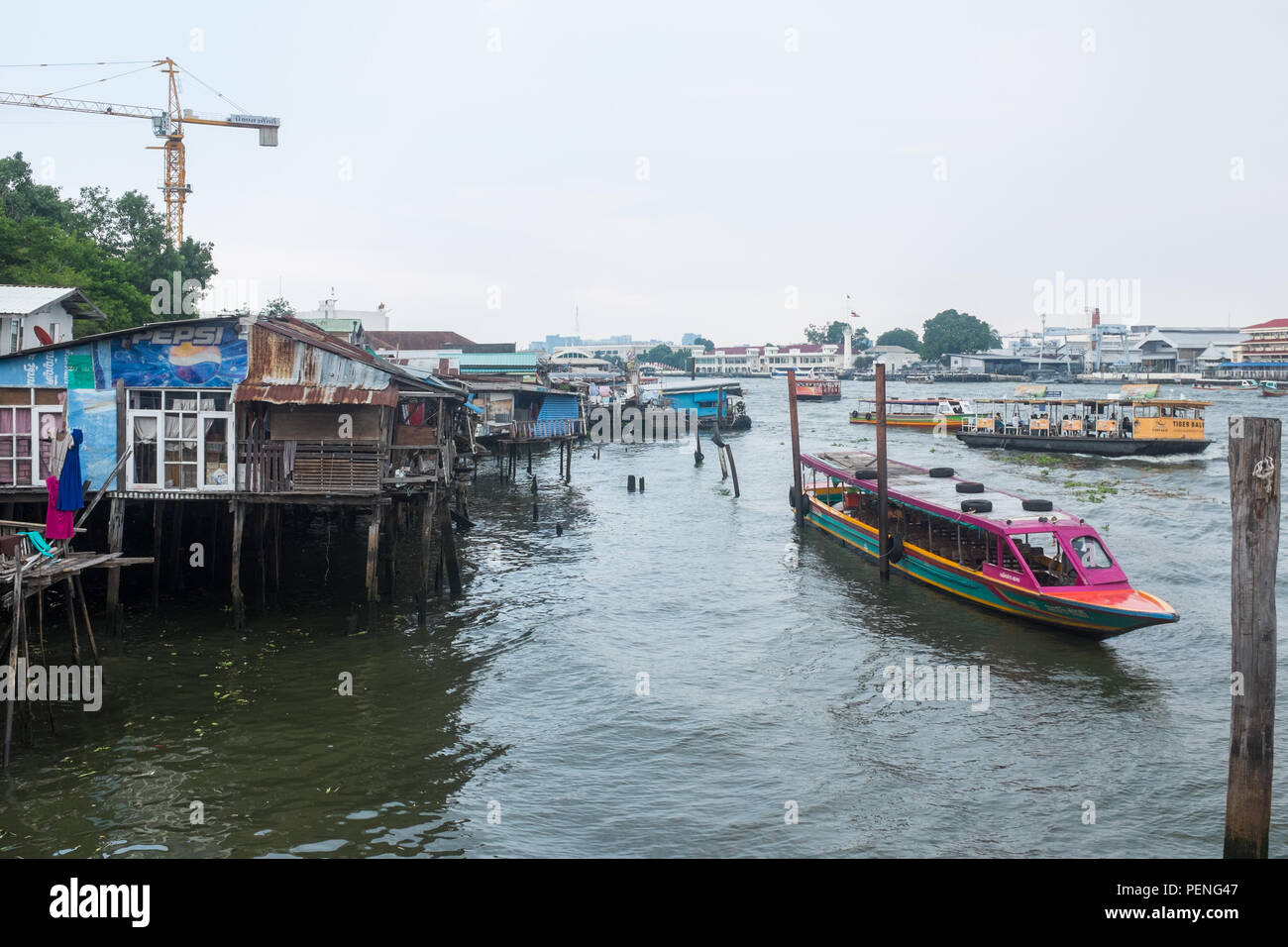 Passenger ferries on the Chao Phraya River in Bangkok, Thailand Stock Photo