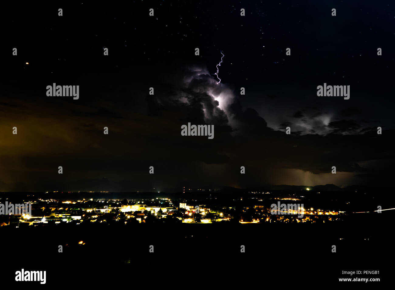 Clouds with Lightning above a City in the night Stock Photo - Alamy