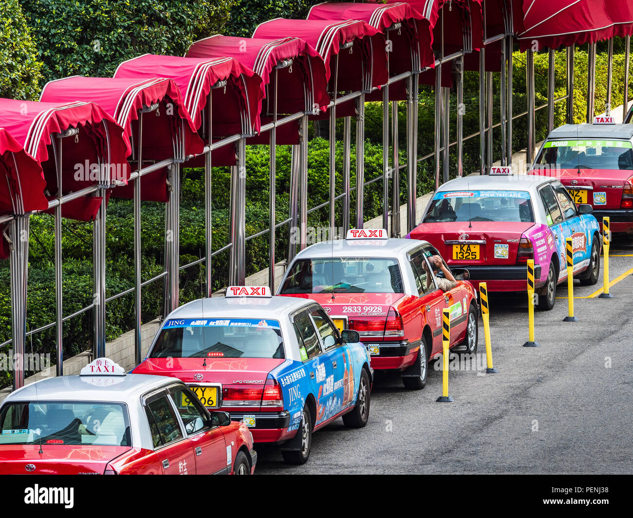 Hong Kong Taxis. Hong Kong Taxi Rank or Hong Kong Taxi Queue Stock Photo