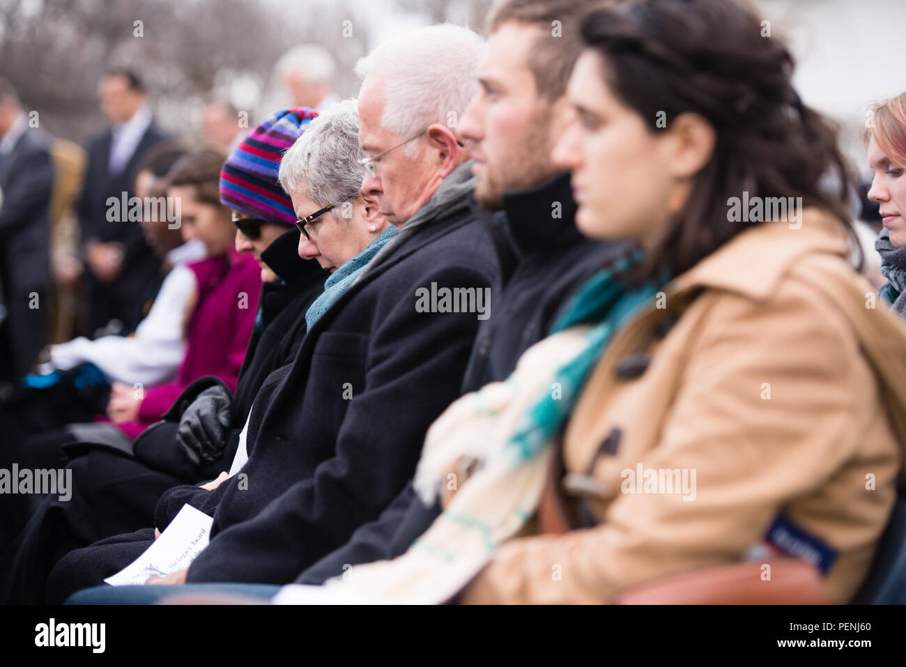 Attendees listen to speakers during the Pan Am Flight 103 memorial ceremony in Arlington National Cemetery, Dec. 21, 2015, in Arlington, Va. A terrorist’s bomb destroyed the aircraft 27 years ago, in what became known as the “Lockerbie bombing,” killing 243 passengers, 16 crew members and 11 people on the ground. (U.S. Army photo by Rachel Larue/Arlington National Cemetery/released) Stock Photo