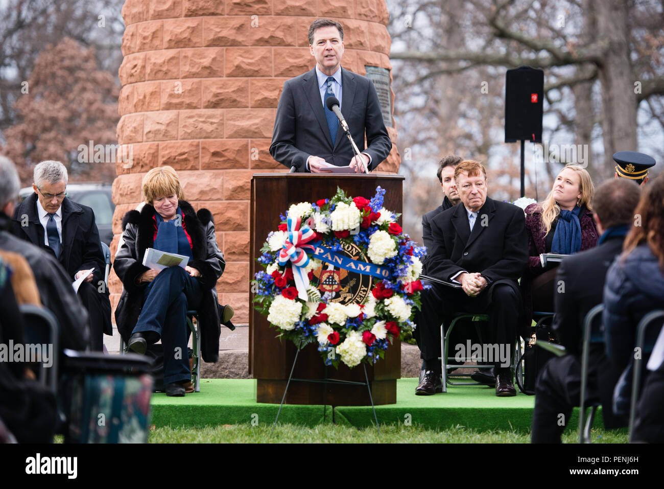 James Comey, director of the Federal Bureau of Investigation, gives remarks during the Pan Am Flight 103 memorial ceremony in Arlington National Cemetery, Dec. 21, 2015, in Arlington, Va. A terrorist’s bomb destroyed the aircraft 27 years ago, in what became known as the “Lockerbie bombing,” killing 243 passengers, 16 crew members and 11 people on the ground. (U.S. Army photo by Rachel Larue/Arlington National Cemetery/released) Stock Photo