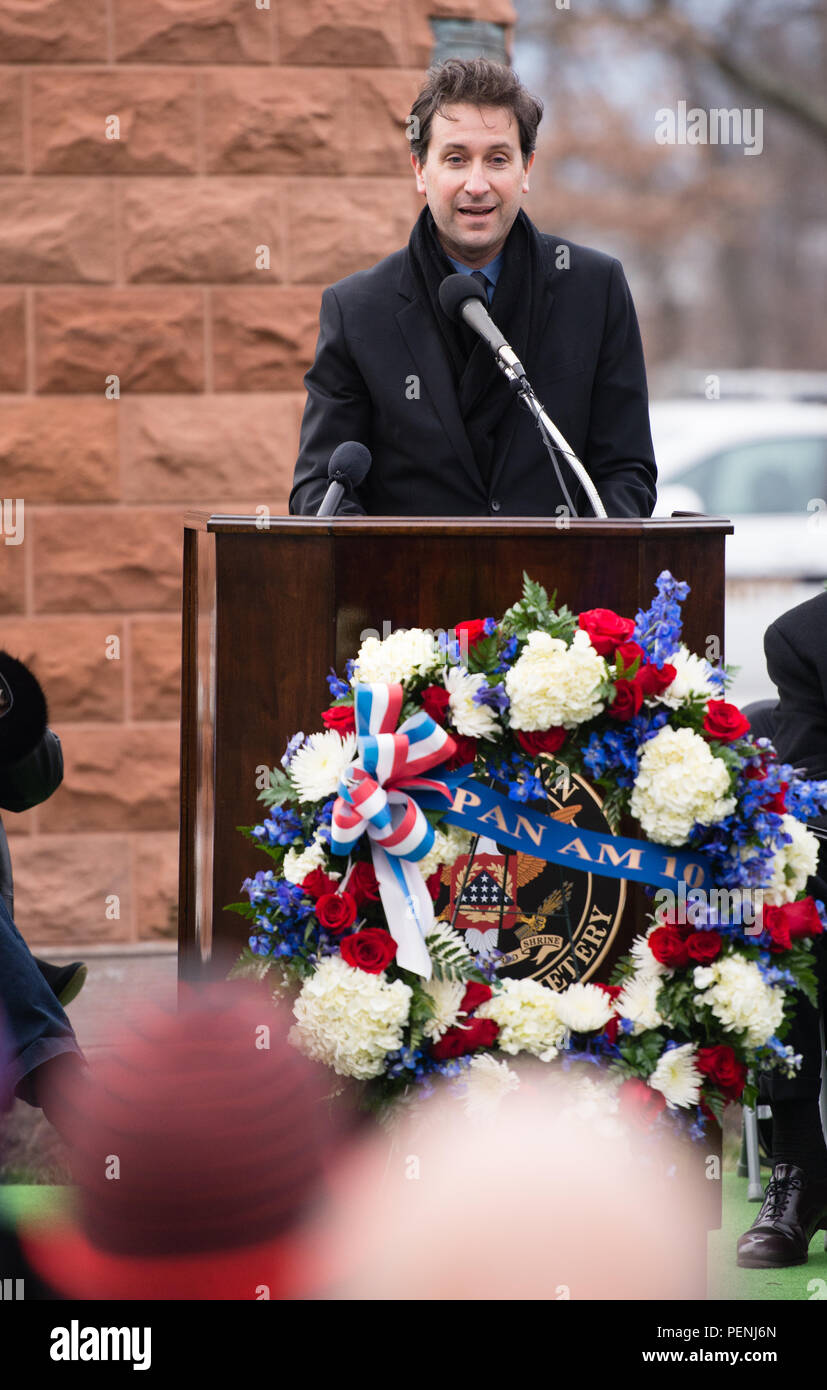 Ken Dornstein, writer and producer who lost his brother on Pan Am Flight 103, gives remarks during the Pan Am Flight 103 memorial ceremony in Arlington National Cemetery, Dec. 21, 2015, in Arlington, Va. A terrorist’s bomb destroyed the aircraft 27 years ago, in what became known as the “Lockerbie bombing,” killing 243 passengers, 16 crew members and 11 people on the ground. (U.S. Army photo by Rachel Larue/Arlington National Cemetery/released) Stock Photo