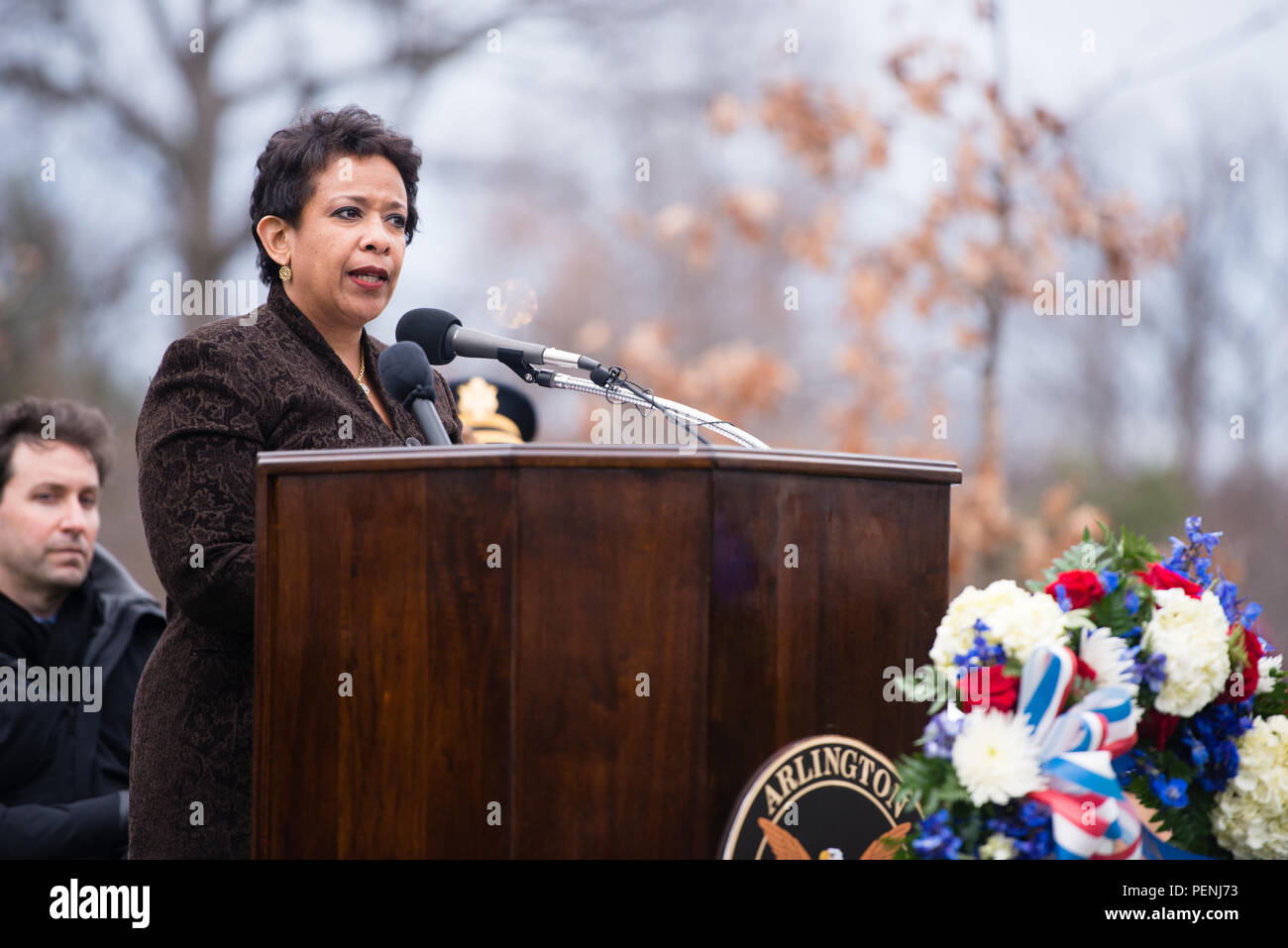 Loretta Lynch, Attorney General of the United States, gives remarks during the Pan Am Flight 103 memorial ceremony in Arlington National Cemetery, Dec. 21, 2015, in Arlington, Va. A terrorist’s bomb destroyed the aircraft 27 years ago, in what became known as the “Lockerbie bombing,” killing 243 passengers, 16 crew members and 11 people on the ground. (U.S. Army photo by Rachel Larue/Arlington National Cemetery/released) Stock Photo