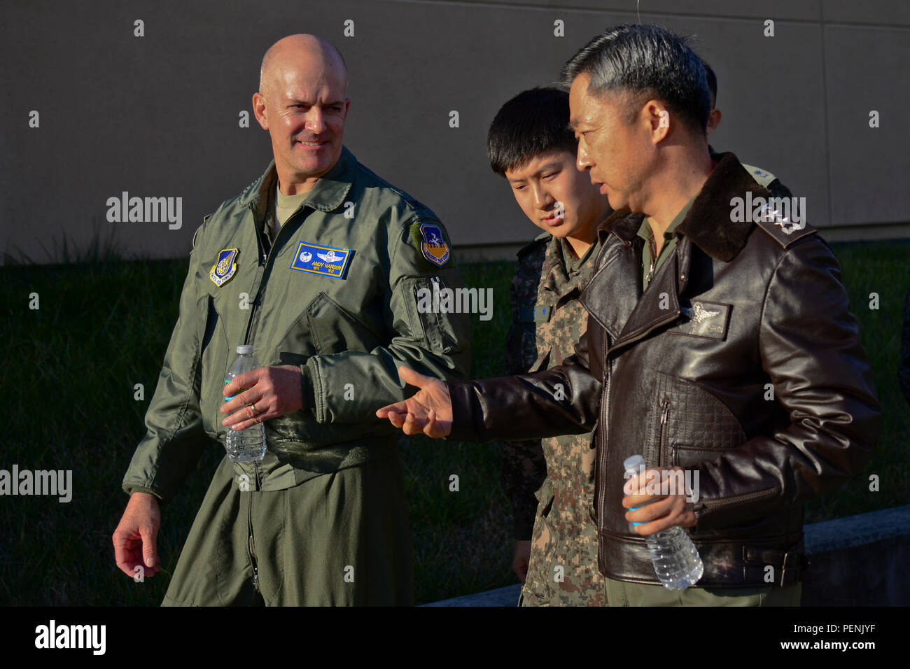 Col. Andrew Hansen, 51st Fighter Wing commander, discusses beddown capabilities with Republic of Korea air force Lt. Gen. Lee, Wang Keun, Air Force Operations Command commander, at Osan Air Base, ROK, Dec. 17, 2015. Senior leaders from the ROK AFOC toured the base to learn about the various aircraft, mission and capabilities the 51st FW supports on the peninsula. (U.S. Air Force photo/Tech. Sgt. Travis Edwards) Stock Photo