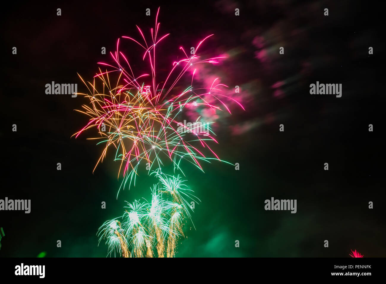 Colorful fireworks of various colors over night sky Stock Photo - Alamy