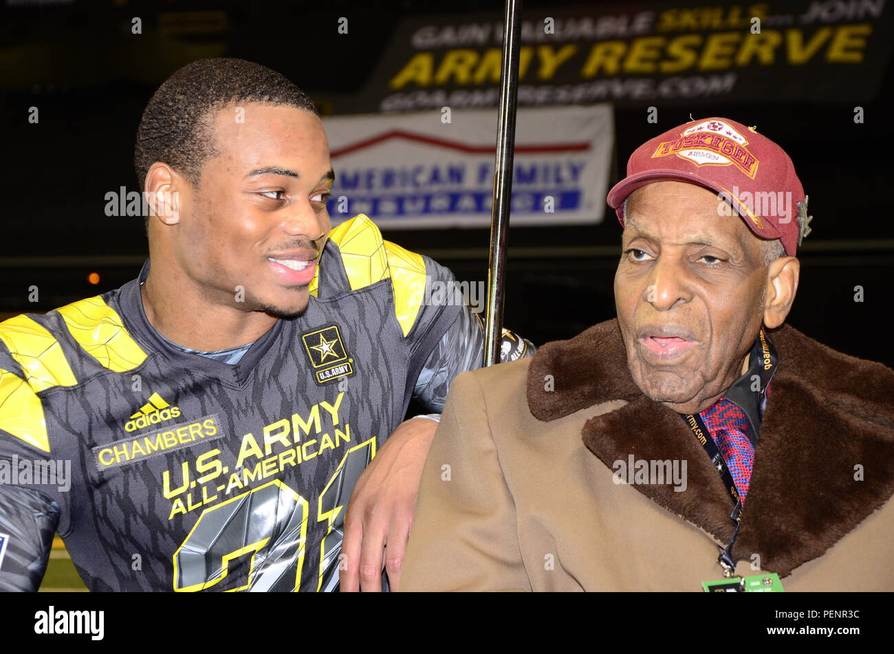 Cameron Chambers (left), East Team player for the 2016 All-American Bowl, and Dr. Granville Coggs (right), a surviving Tuskegee Airmen, meet before the 2016 All-American Bowl, Jan. 9. Chambers great uncle Wesley C. Walker was a Tuskegee Airmen who entered the Lonely Eagle Chapter in 2005 at the age of 85. During the pregame ceremonies, Coggs and fellow Tuskegee Airmen, Theodore Johnson, were introduced to the crowd at midfield. The AAB is U.S. Army sponsored bowl game that features the top 90 high school football players in the Nation. Stock Photo