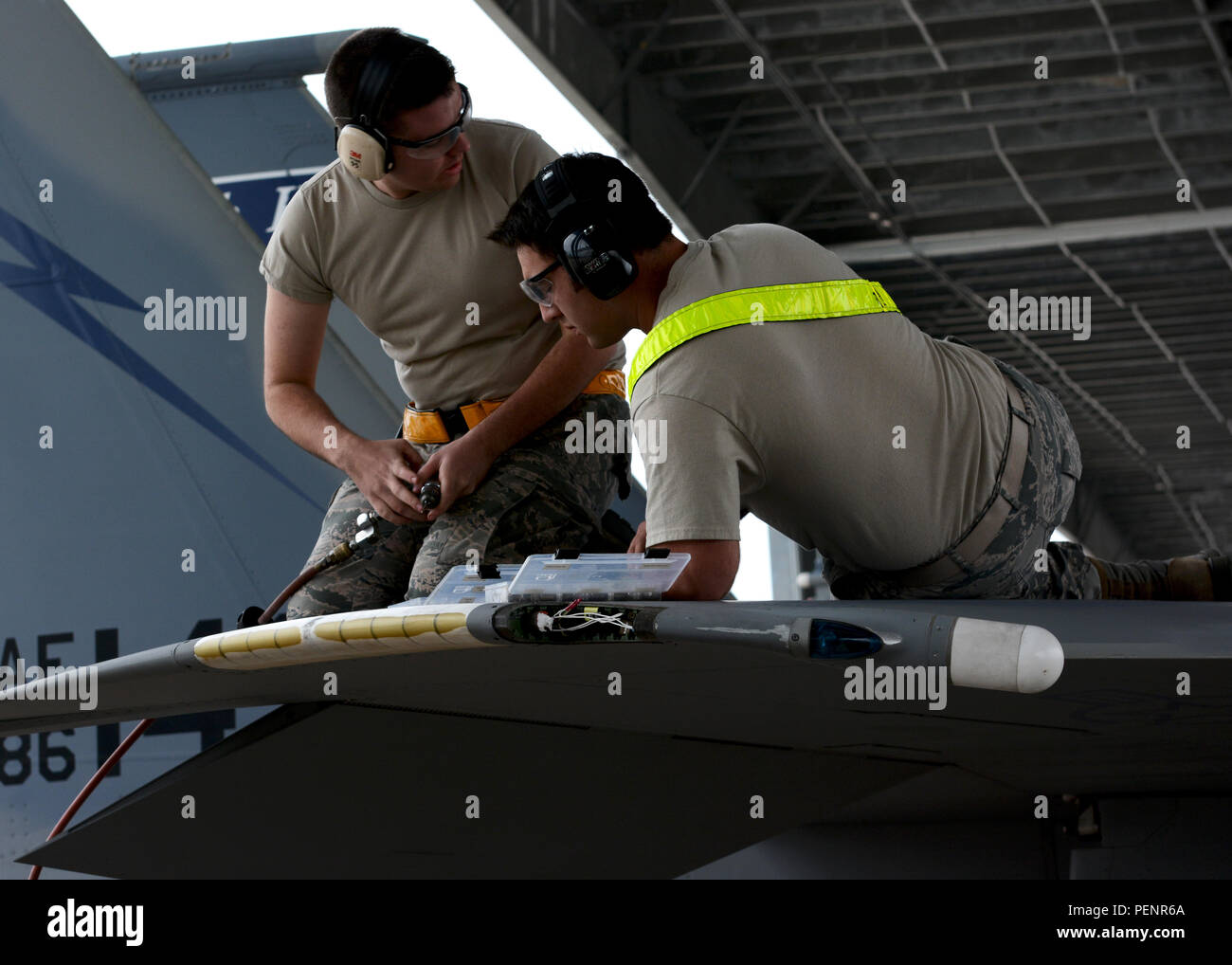 Two U.S. Air Force airmen from the 125th Fighter Wing Machine shop work