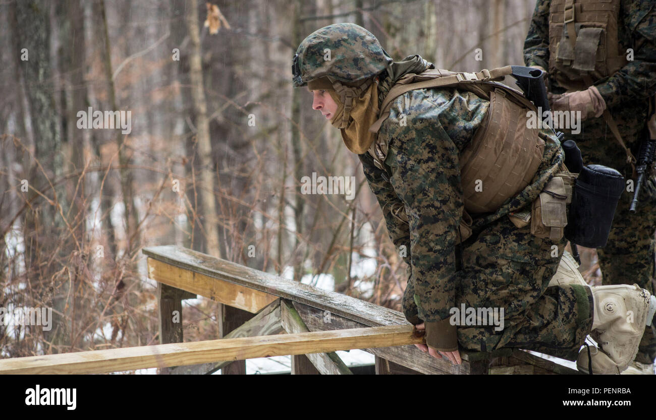 U.S. Marines with Alpha Company, 1st Battalion, 25th Marine Regiment, 4th Marine Division, Marine Forces Reserve, conduct a leadership reaction course on U.S. Army Mountain Warfare Center in Ethan Allen, Vt., Jan. 10, 2016. The Marines were split in to three teams given a different challenge at each station; the course is designed to make every Marine work together as a leader and as a team. (U.S. Marine Corps photo by Lance Cpl. Kimberly Aguirre/Released) Stock Photo