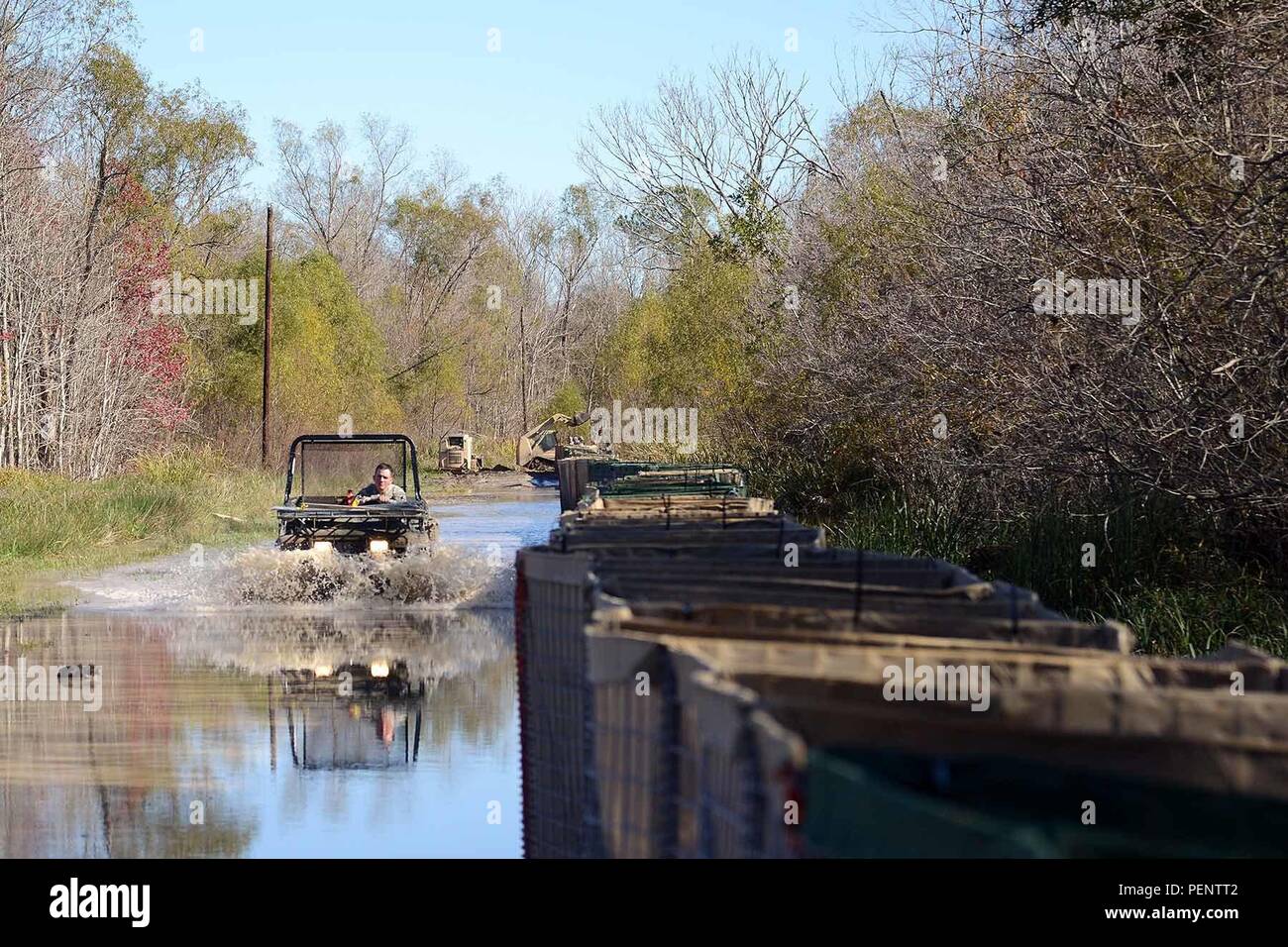 The Louisiana National Guard continues to work around the clock, constructing HESCO barrier