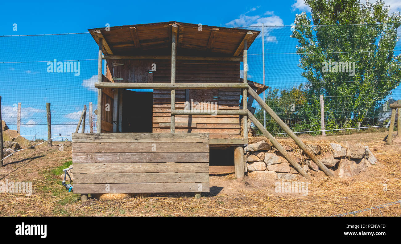 small wooden shack used for animals in a meadow Stock Photo Alamy