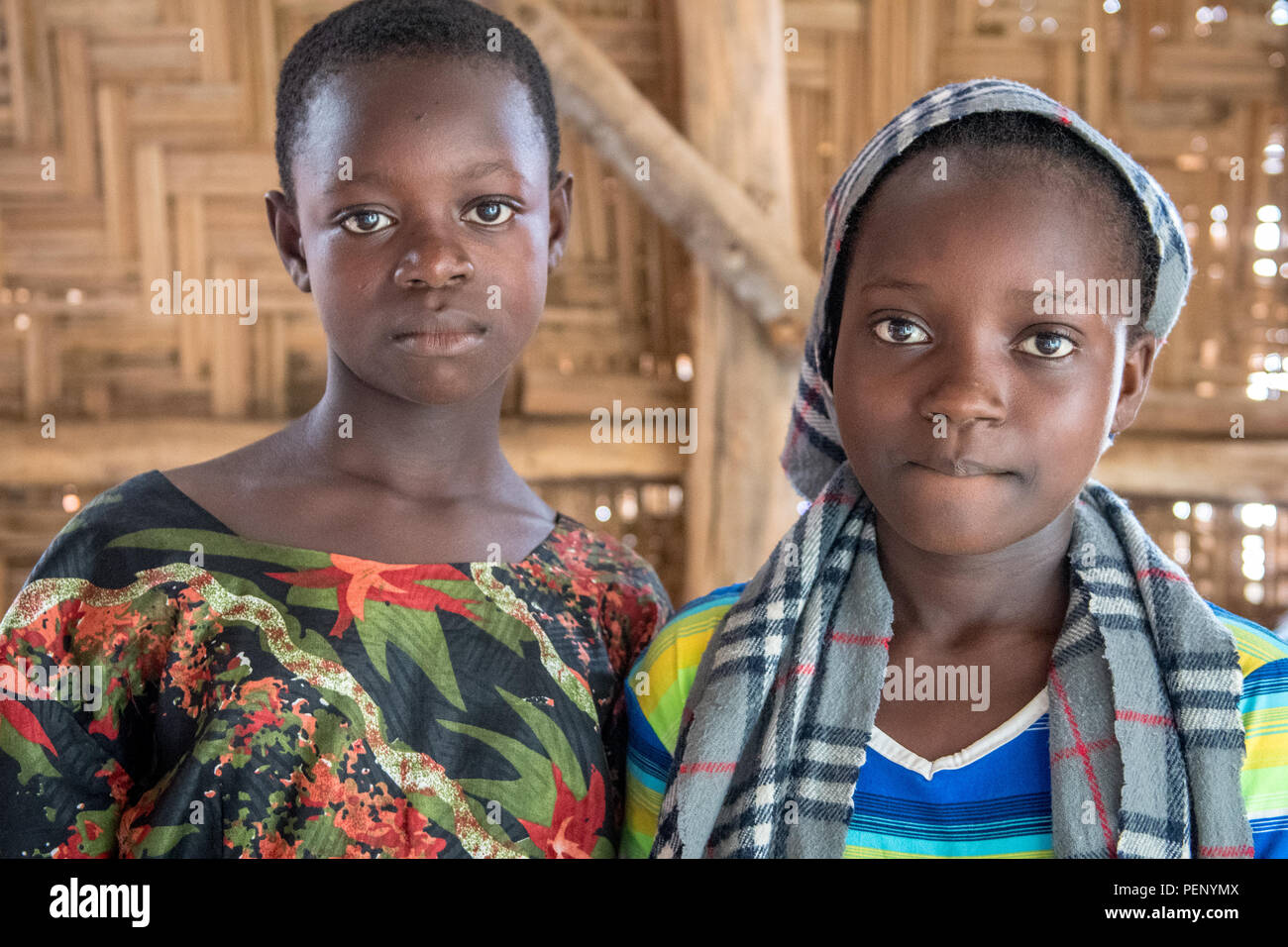 Two girls pose for the camera  in Ganta, Liberia Stock Photo