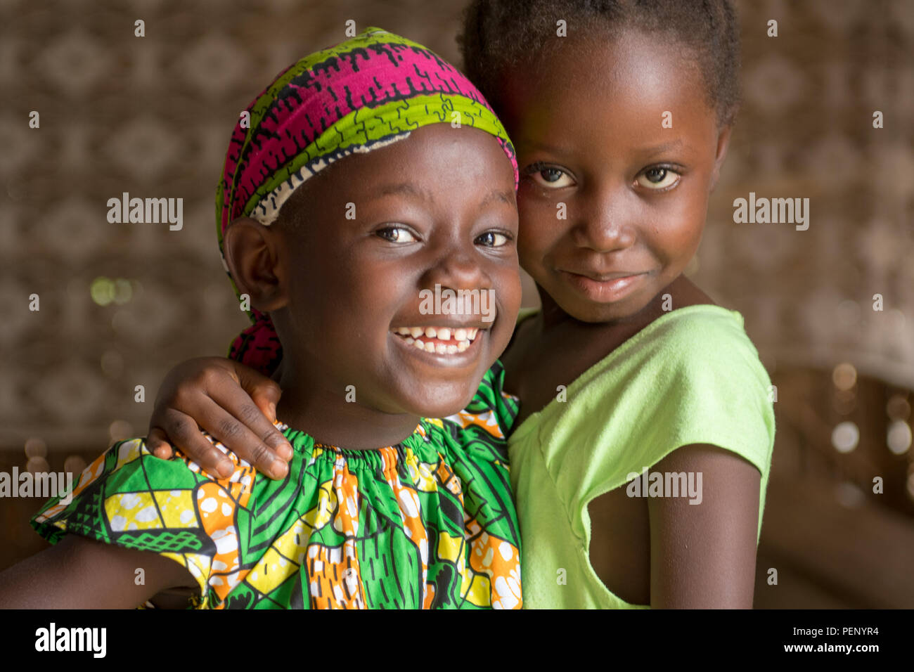 Two girls pose for the camera  in Ganta, Liberia Stock Photo