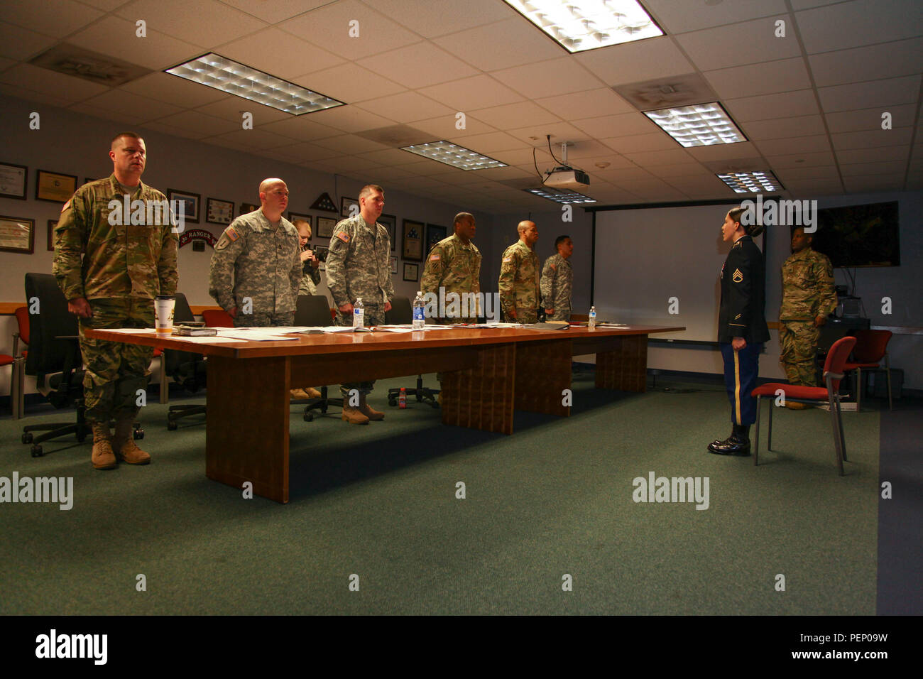 U.S. Army Staff Sgt. Patricia Ramirez, assigned to 55th Signal Company (Combat Camera), recites the Creed of the Noncommissioned Officer to the members of the board at Fort George G. Meade, Md., Dec. 17, 2015. Ramirez participated in the quarterly board to compete for the best NCO of the Quarter. (U.S. Army photo by Spc. Pablo Chang/Released) Stock Photo