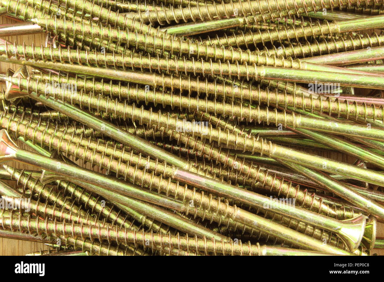 composition of wood screws on a wooden board Stock Photo
