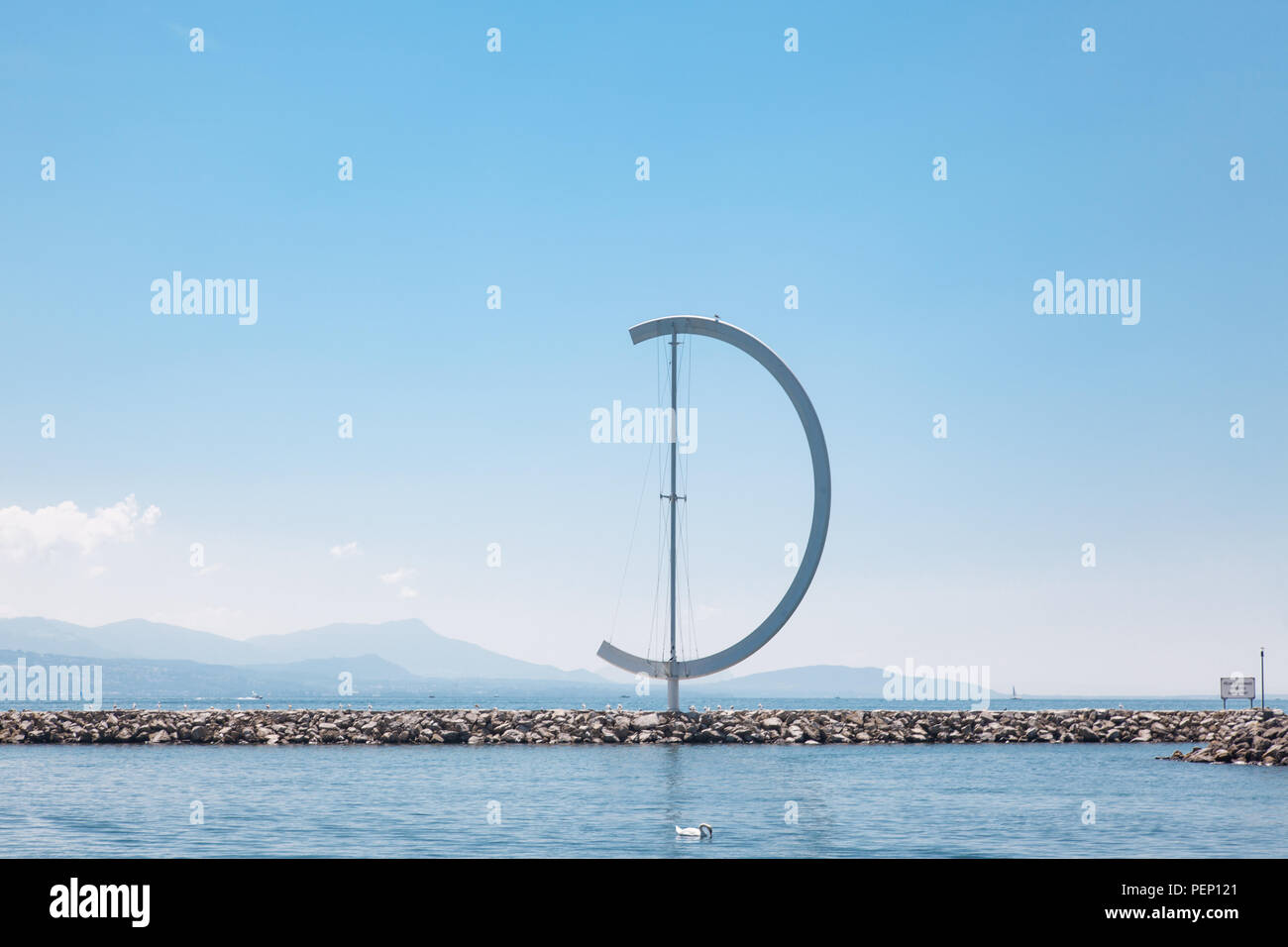 The Eole - large, semi-circular wind vane  by the lakeside wall at the port of Ouchy, Lausanne, Switzerland on sunny summer day Stock Photo