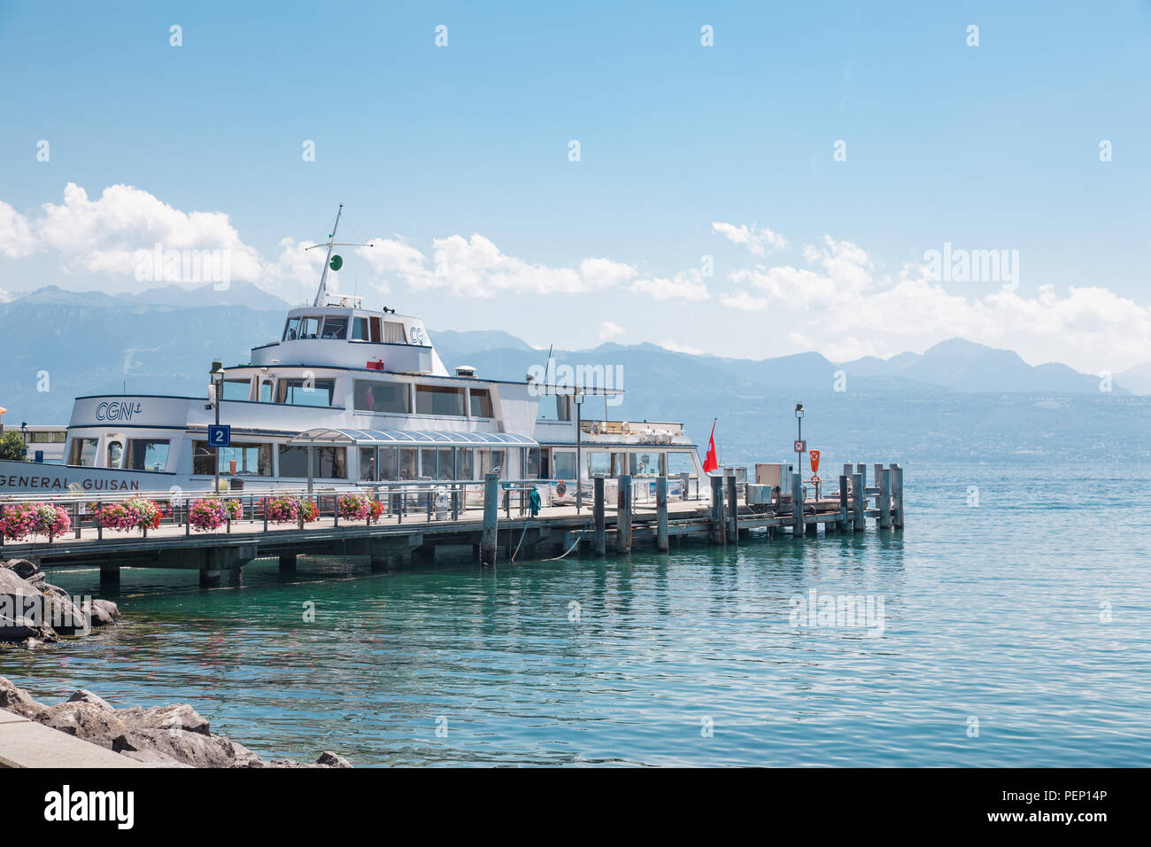 Passenger ship docked at pier in Lausanne Ouchy port, Switzerland on Lake Leman (Geneva Lake) on sunny summer day Stock Photo