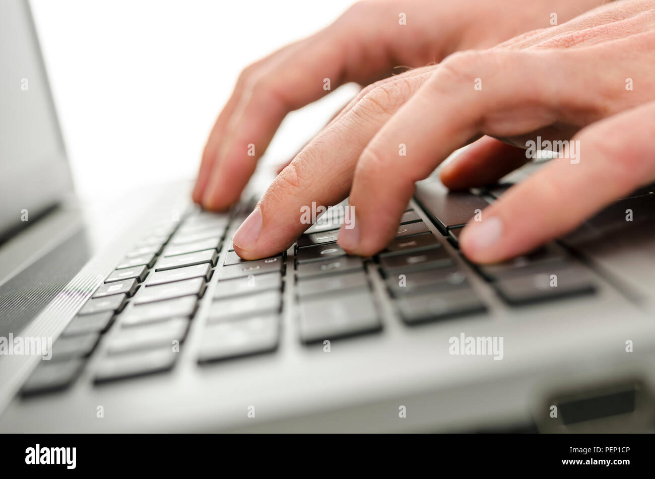 Closeup of businessman hands typing on laptop keyboard. Stock Photo