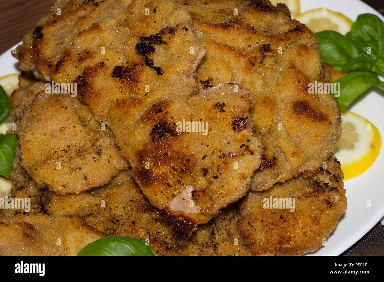 Several original veal schnitzel on a large plate Stock Photo Alamy