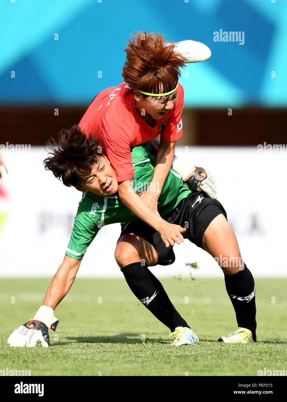 (180816) -- PALEMBANG, Aug. 16, 2018(Xinhua) -- Tsai Mingjung (bottom), goalkeeper of Chinese Taipei, competes during the Women's Football Group A match between South Korea and Chinese Taipei at the 18th Asian Games 2018 in Palembang, Indonesia, Aug. 16, 2018. (Xinhua/Cheng Min) Stock Photo