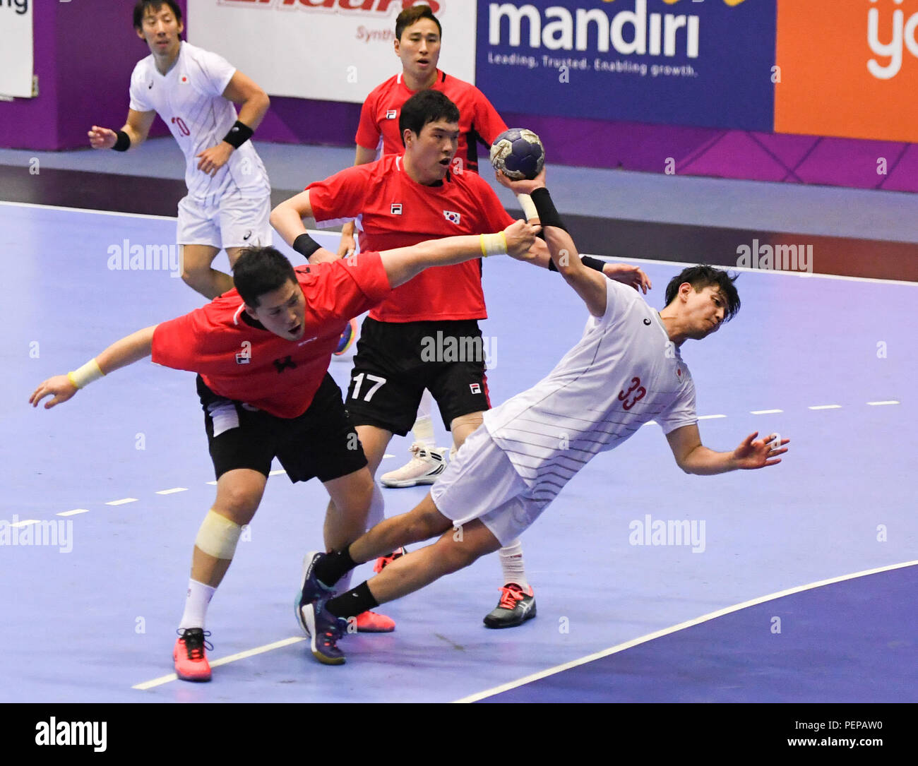 Jakarta. 17th Aug, 2018. Agarie Yuto (1st R) of Japan competes during the Men's Handball Preliminary Round Group B match between Japan and South Korea at the Asian Games 2018 in Jakarta, Indonesia on Aug. 17, 2018. The match ended with a 26-26 draw. Credit: Li He/Xinhua/Alamy Live News Stock Photo