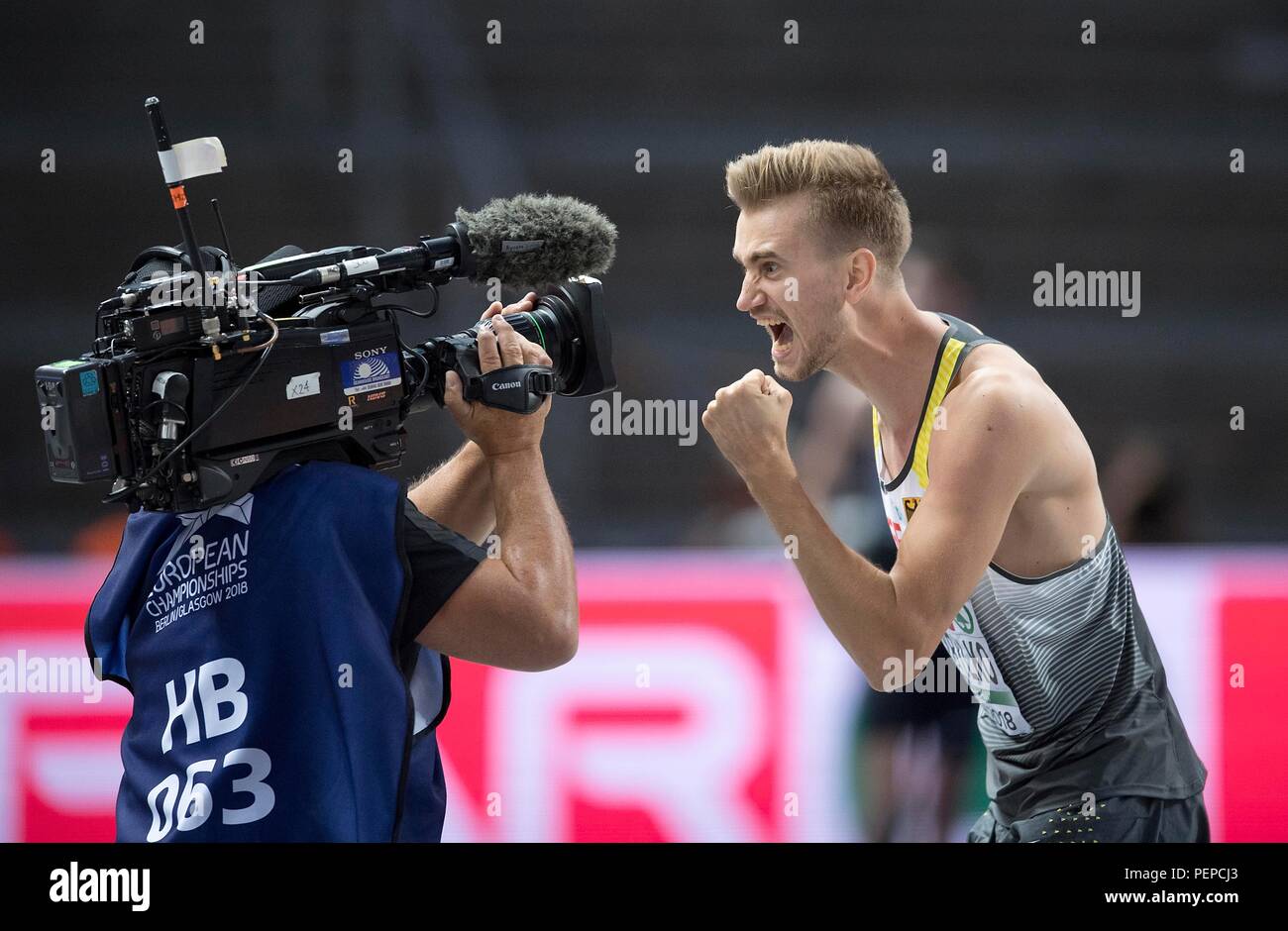 Berlin, Deutschland. 11th Aug, 2018. Winner Mateusz PRZYBYLKO, Germany, 1st place, cheers in a TV camera. Final high jump of the men, on 11.08.2018 European Athletics Championships 2018 in Berlin/Germany from 06.08. - 12.08.2018. | usage worldwide Credit: dpa/Alamy Live News Stock Photo