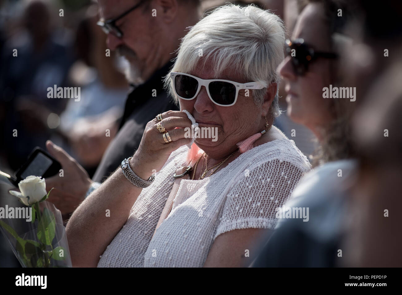Barcelona, Spain. 17th Aug 2018. August 17, 2018 - Barcelona, Catalonia, Spain -  A woman reacts in Barcelona during the homenage  for the victims of last year's terror attacks  that  killed  16 people and injured more than 120  when two vehicles crashed into the crowds. Credit:  Jordi Boixareu/Alamy Live News Stock Photo