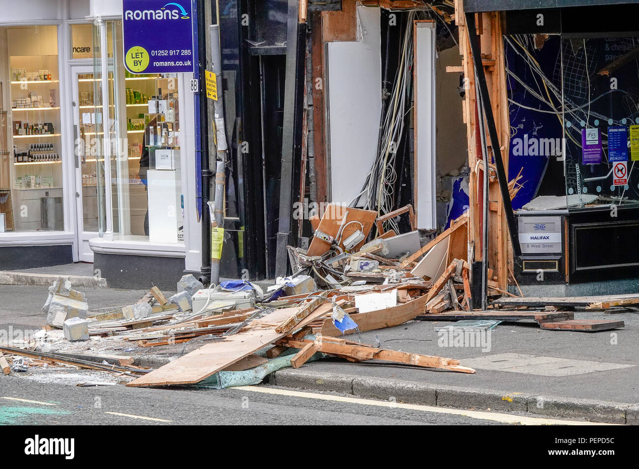 West Street, Farnham. 17th August 2018. Ram raiders struck again in south west Surrey overnight. They drove a JCB into the Halifax Building Society in Farnham before escaping with an ATM full of cash. Surrey Police have been in attendance throughout the day today. Credit: james jagger/Alamy Live News Stock Photo