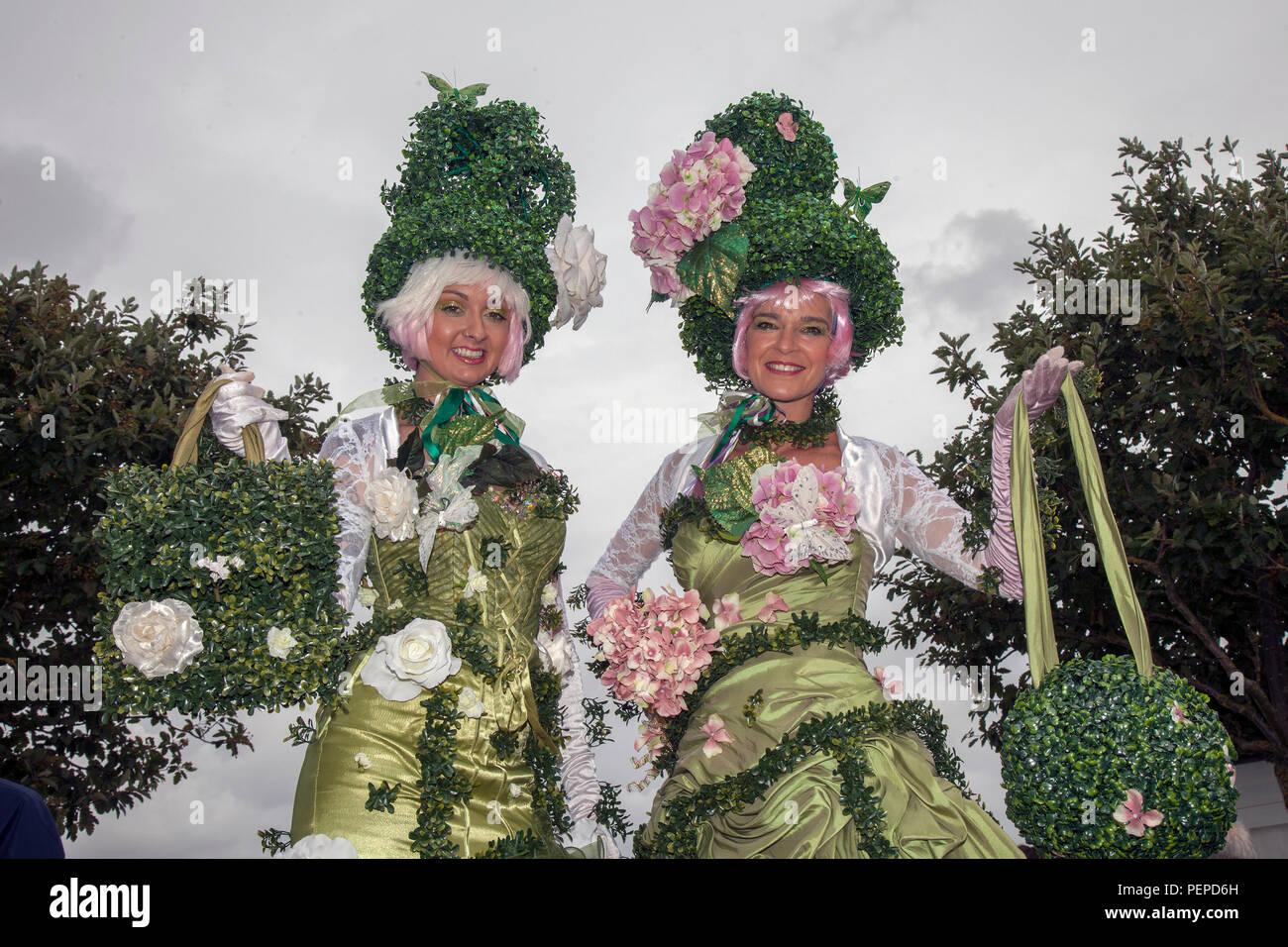 Southport, Merseyside, UK. 17th Aug, 2018. The Topiary Twins stilt walkers at Southport Flower Show as entertainers, exhibitors, garden designers, and floral artists wow the visitors to this famous annual event. Credit; MediaWorldImages/AlamyLiveNews Stock Photo