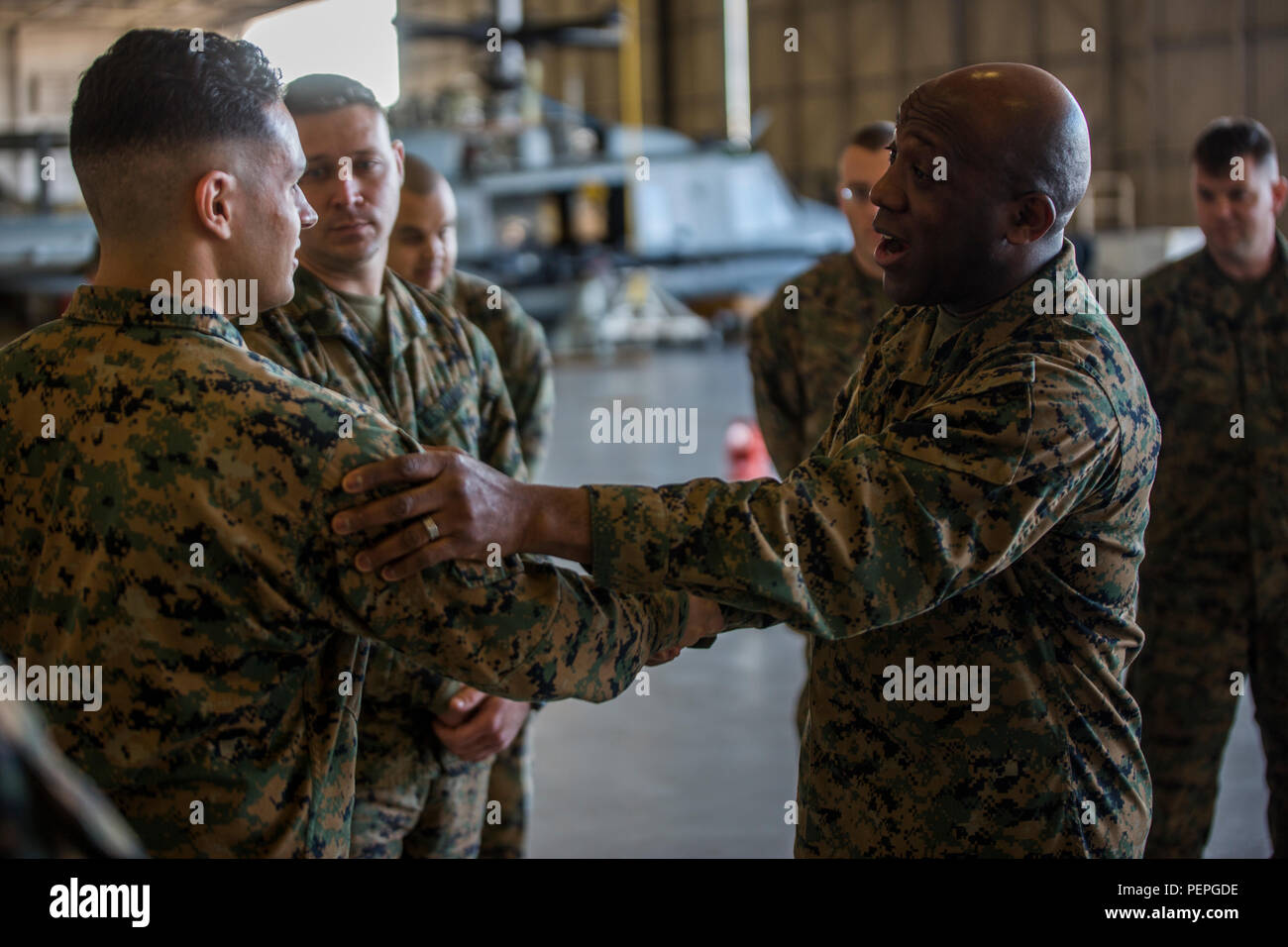 Sergeant Major of the Marine Corps, Sgt. Maj. Ronald L. Green, greets Marines of Marine Aircraft Group 49, 4th Marine Aircraft Wing, at Naval Air Station Joint Reserve Base New Orleans, Jan. 19, 2016. Sgt. Maj. Green addressed the Marines as a group and individually, urging them to protect what they’ve earned as a Marine and to continue upholding the standards of the Corps, on and off duty. Stock Photo