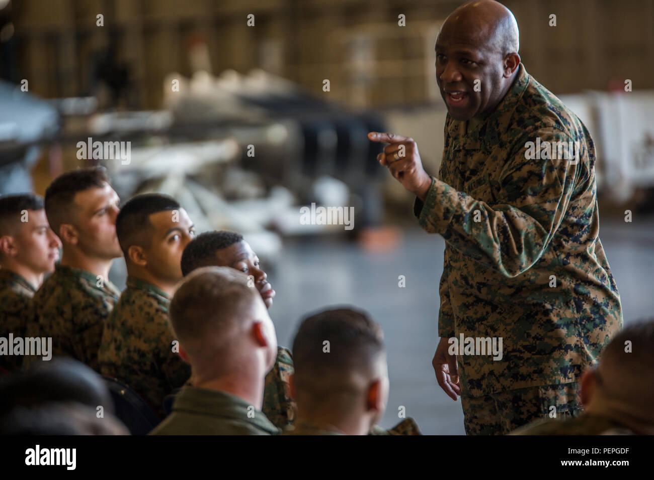 Sergeant Major of the Marine Corps, Sgt. Maj. Ronald L. Green, addresses Marines with Marine Aircraft Group 49, 4th Marine Aircraft Wing, at Naval Air Station Joint Reserve Base New Orleans, Jan. 19, 2016. Sgt. Maj. Green spoke of his time in the Marine Corps, explained how he arrived to the position he holds today, and urged the Marines to stand up and share their experiences as well. Sgt. Maj. Green commended Marines for their hard work and encouraged them to protect what they’ve earned as a Marine. He also emphasized the importance of upholding the standards of the Corps on and off duty. Stock Photo