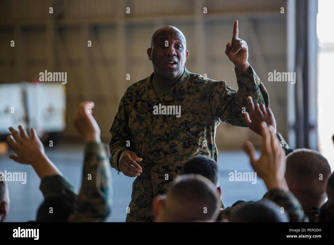 Sergeant Major of the Marine Corps, Sgt. Maj. Ronald L. Green, addresses Marines of Marine Aircraft Group 49, 4th Marine Aircraft Wing, at Naval Air Station Joint Reserve Base, New Orleans, Jan. 19, 2016. Sgt. Maj. Green discussed some of his experiences in the Marine Corps, explained how he arrived to the position he is in today, and urged the Marines to stand up and share their experiences in the Corps. Green also commended Marines for their hard work, encouraged them to protect what they’ve earned as a Marine, and emphasized the importance of upholding the standards of the Corps on and off  Stock Photo