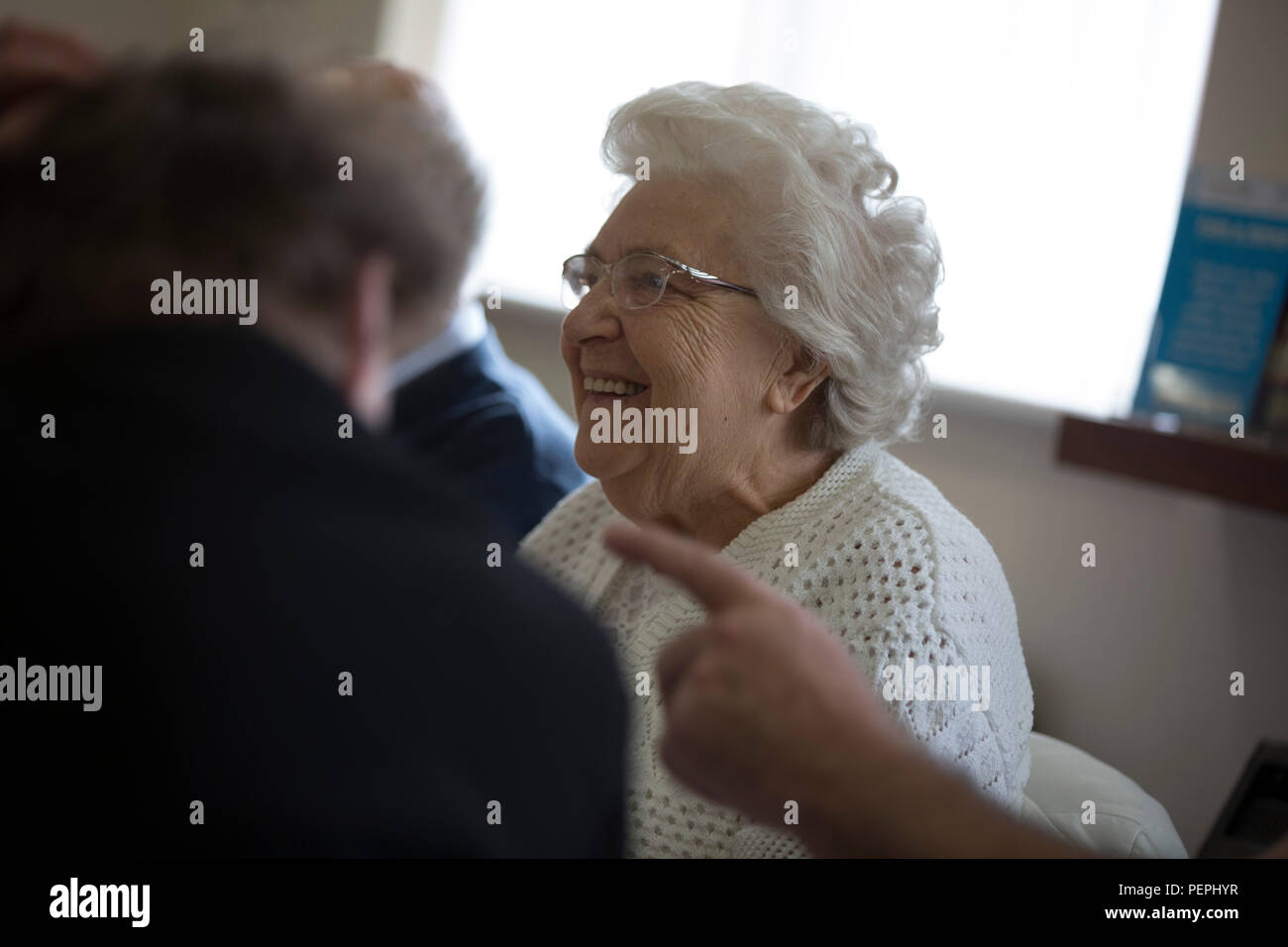 Older lady smiling, laughing and enjoying herself Stock Photo