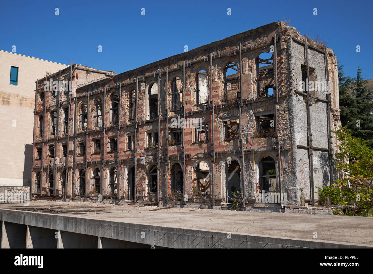 The ruins of the Hotel Neretva, nicknamed 'Tito's palace', at Mostar, Bosnia and Herzegovina. Stock Photo