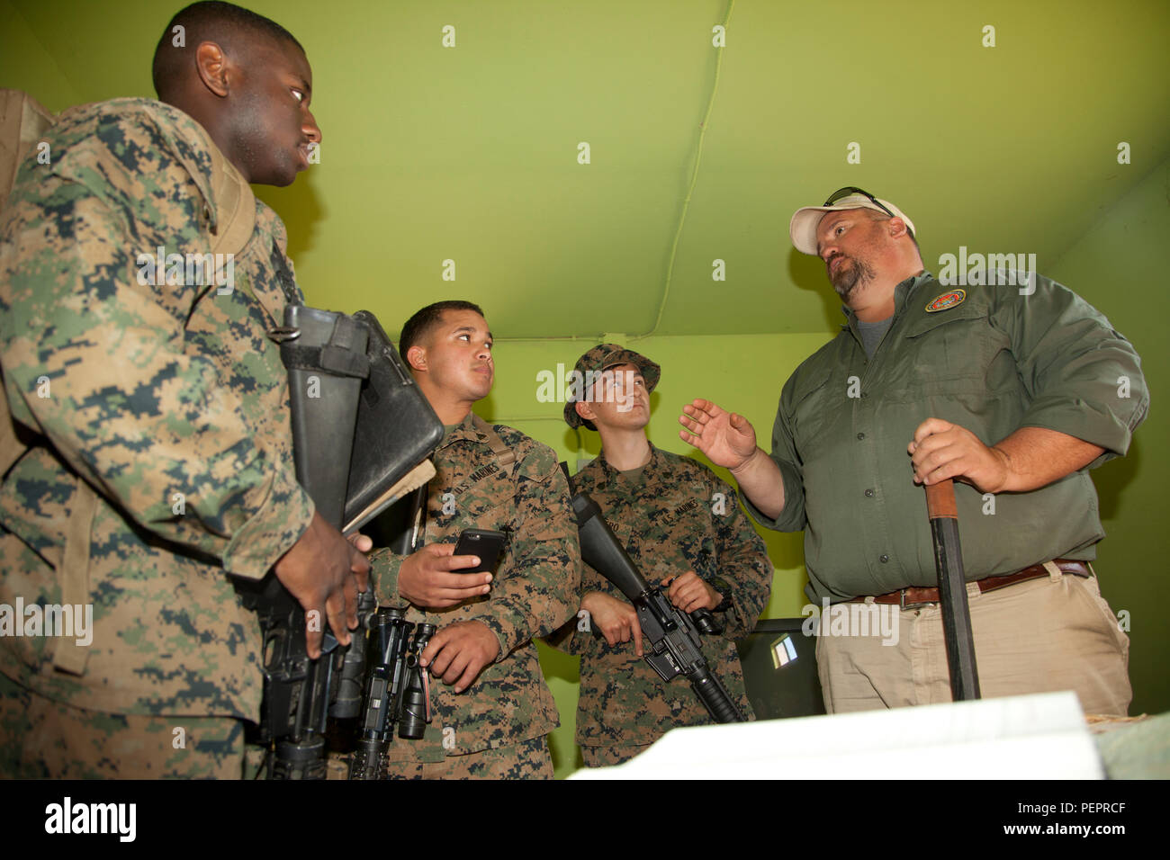 Bob Newell, with Marine Corps Engineer School, instructs Marines with