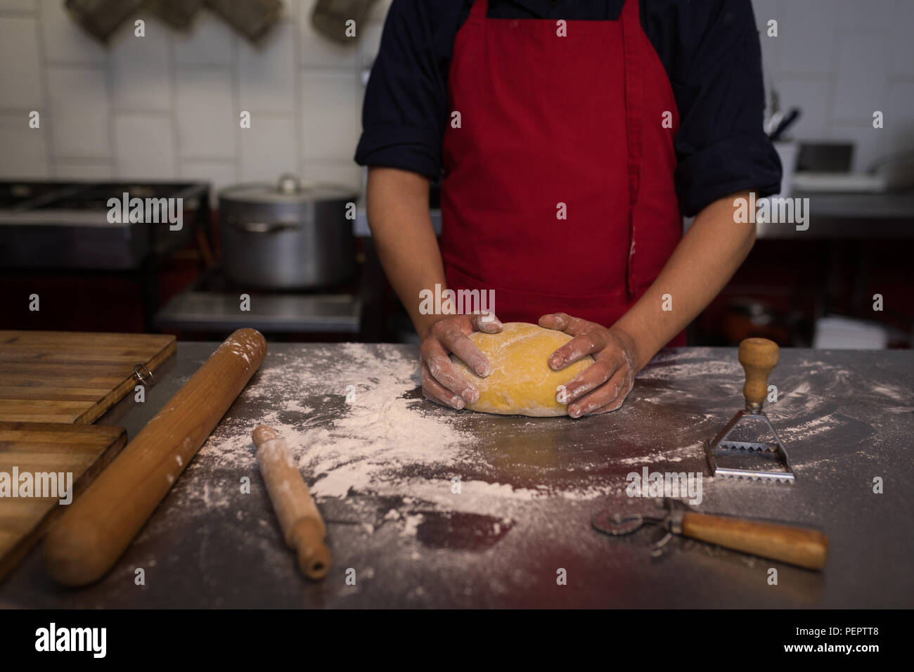 Baker holding a proof dough Stock Photo