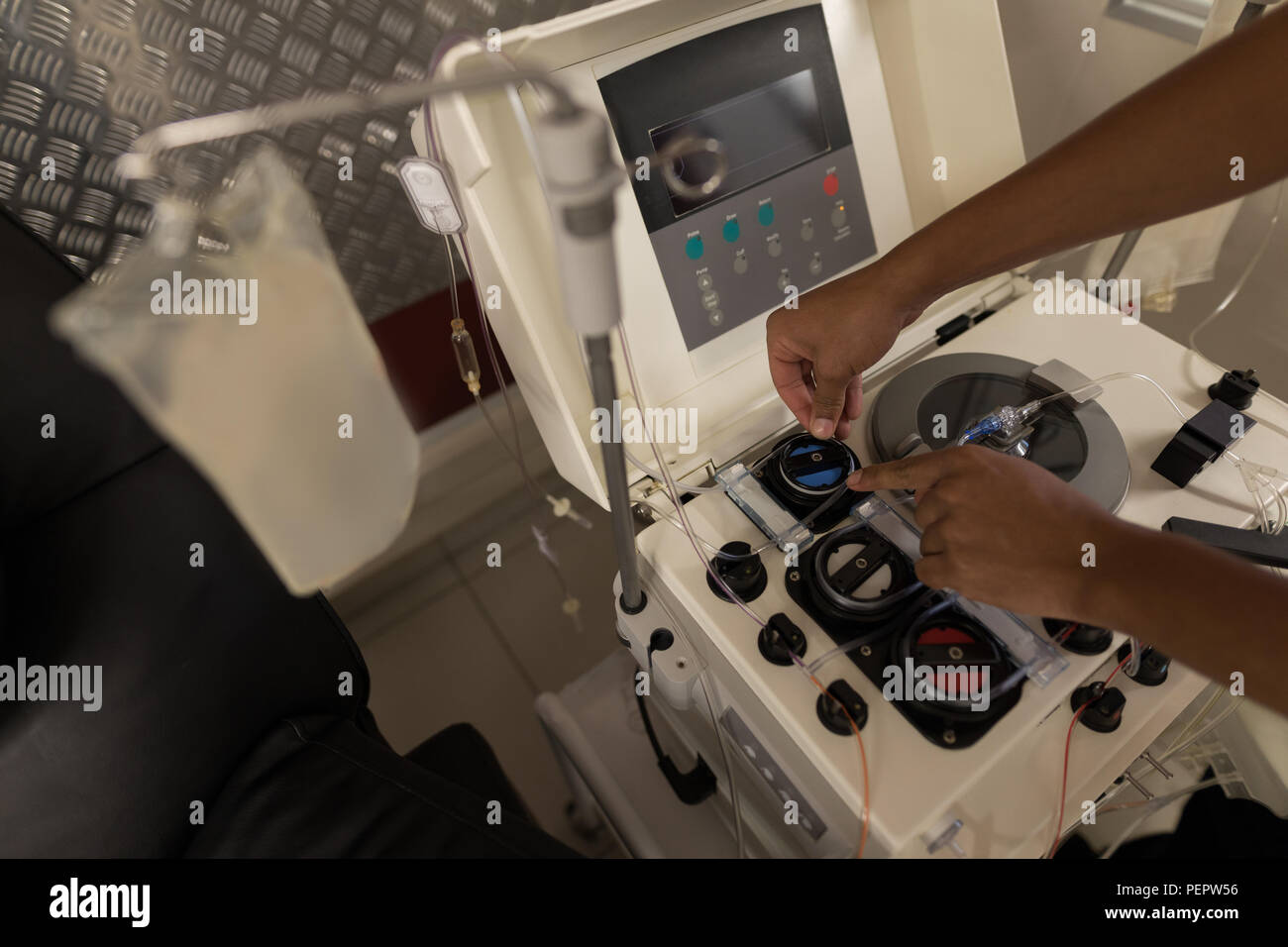 Laboratory technician using machine in blood bank Stock Photo Alamy