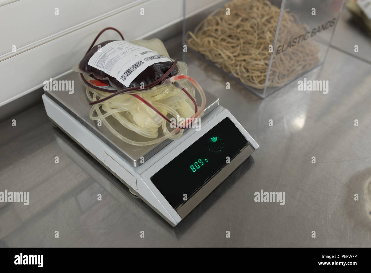Blood bag on weighing scale machine Stock Photo Alamy