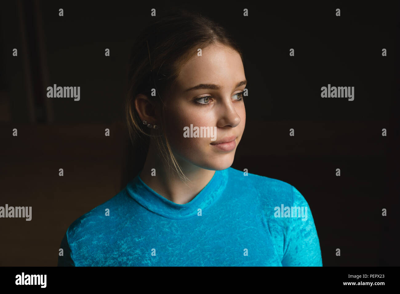 Ballerina looking away at dance studio Stock Photo