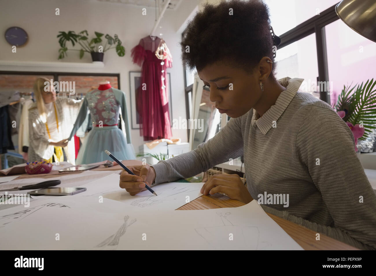 Fashion designer drawing sketch Stock Photo