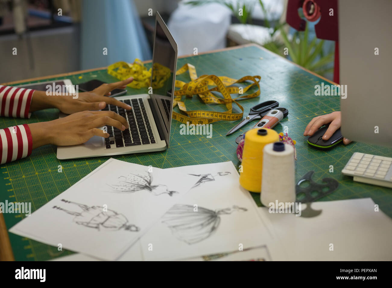 Fashion designer using laptop Stock Photo Alamy