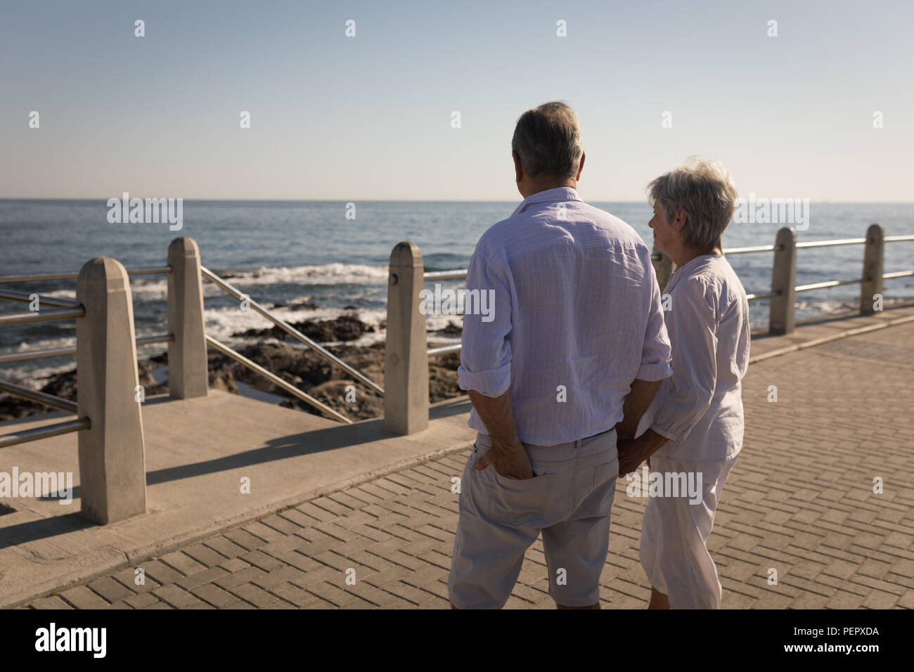 Senior couple standing near sea side Stock Photo